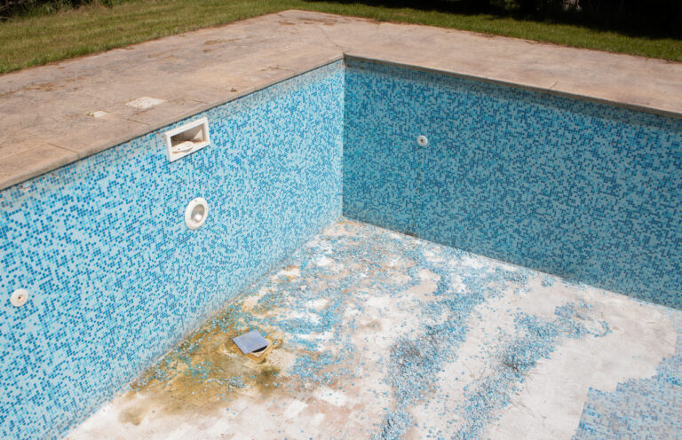 construction and cleaning work on an old swimming pool