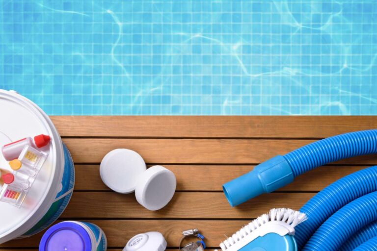 Various types of pool equipment and products are set along the poolside.
